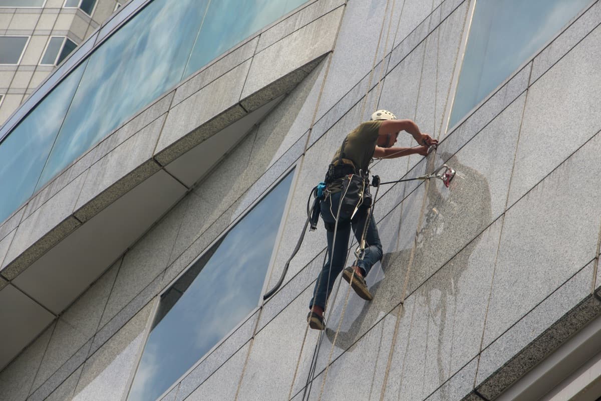 Window cleaner abseiling on a high-rise